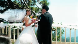 Bride and groom exchanging vows in the mountains.